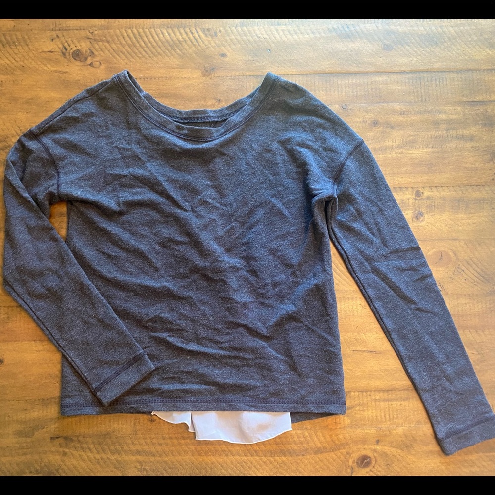 Gray top with sheer back insert.